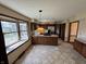 Kitchen with tile floors, stainless steel refrigerator, and breakfast bar with gas stovetop at 1235 Cottonwood Ct, Carmel, IN 46033