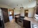 Spacious kitchen featuring a stainless steel Viking range, granite countertops, and stylish tile flooring at 1235 Cottonwood Ct, Carmel, IN 46033