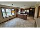 Kitchen with tile floors, stainless steel refrigerator, breakfast bar with gas stovetop, and bay window at 1235 Cottonwood Ct, Carmel, IN 46033