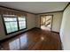 Inviting living room with gleaming hardwood floors and a view into the entry way at 1235 Cottonwood Ct, Carmel, IN 46033