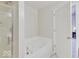 Bathroom with a large tub, shower, modern fixtures, and neutral walls at 12723 Pinetop Way, Noblesville, IN 46060