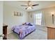 Cozy bedroom showcasing a ceiling fan, carpet, window, and a charming Frozen-themed bedspread at 12723 Pinetop Way, Noblesville, IN 46060