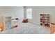 Bright bedroom featuring gray carpet, window, and 's furniture at 12723 Pinetop Way, Noblesville, IN 46060