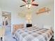 Bedroom with ceiling fan, a large window for natural light, and neutral walls at 12723 Pinetop Way, Noblesville, IN 46060