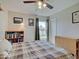Cozy bedroom with ceiling fan, a large window for natural light, and neutral walls at 12723 Pinetop Way, Noblesville, IN 46060