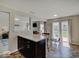 Bright dining area with a sliding glass door and breakfast bar, perfect for casual meals and entertaining at 12723 Pinetop Way, Noblesville, IN 46060