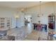 Open-concept dining room adjacent to living room featuring high ceilings and wood floors at 12723 Pinetop Way, Noblesville, IN 46060