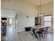 Dining room with a large table and seating for six, under a modern chandelier at 12723 Pinetop Way, Noblesville, IN 46060