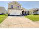 Charming two-story home with a two-car garage, long driveway, and well-manicured front lawn at 12723 Pinetop Way, Noblesville, IN 46060