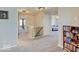 Upstairs hallway with gray carpet, safety gate, and red bookcase at 12723 Pinetop Way, Noblesville, IN 46060
