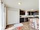 Bright eat-in kitchen with dark cabinets, stainless appliances, and a breakfast bar, perfect for Gathering meals at 12723 Pinetop Way, Noblesville, IN 46060