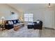 Cozy living room featuring a comfortable leather sofa, chair, and a rustic wooden coffee table at 12723 Pinetop Way, Noblesville, IN 46060