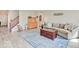 Spacious living room with hardwood floors, a cozy sofa, and a decorative rug, perfect for relaxation at 12723 Pinetop Way, Noblesville, IN 46060