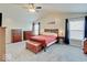Spacious main bedroom featuring a ceiling fan, hardwood furniture, and two windows at 12723 Pinetop Way, Noblesville, IN 46060