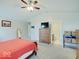 Bright main bedroom with neutral walls, ceiling fan, ensuite bathroom, and a large window for natural light at 12723 Pinetop Way, Noblesville, IN 46060