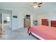 Spacious main bedroom featuring a ceiling fan, hardwood furniture, and two windows at 12723 Pinetop Way, Noblesville, IN 46060