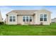 Well-maintained backyard featuring a green lawn and patio perfect for relaxation at 12914 Shiraz Ln, Fishers, IN 46037