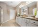 A spacious bathroom with a double sink vanity, framed mirror, and a glass-enclosed shower at 12914 Shiraz Ln, Fishers, IN 46037