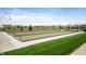 A well-maintained bocce ball court surrounded by green grass and landscaping, ideal for outdoor recreation at 12914 Shiraz Ln, Fishers, IN 46037