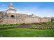 Inviting community entrance with stone signage, clock tower and landscaping at 12914 Shiraz Ln, Fishers, IN 46037