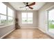 A bright dining area with large windows providing a view of the backyard and pond at 12914 Shiraz Ln, Fishers, IN 46037