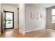 Inviting foyer with wood floors, neutral walls, and ample natural light at 12914 Shiraz Ln, Fishers, IN 46037