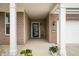 Charming front porch with brick pillars, flower pots, and a welcoming front door at 12914 Shiraz Ln, Fishers, IN 46037