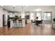 Open kitchen with stainless steel appliances, granite countertops, and a dining area with lots of natural light at 12914 Shiraz Ln, Fishers, IN 46037