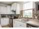 A kitchen featuring stainless steel appliances, granite countertops, and mosaic tile backsplash at 12914 Shiraz Ln, Fishers, IN 46037