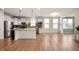 Open-concept kitchen featuring white cabinets, granite countertops, stainless steel appliances, and modern finishes at 12914 Shiraz Ln, Fishers, IN 46037