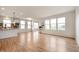 Expansive living room with abundant natural light, wood flooring, and an open layout at 12914 Shiraz Ln, Fishers, IN 46037