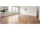 Bright living room with laminate floors, large windows, and views of the backyard at 12914 Shiraz Ln, Fishers, IN 46037