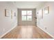 Bright and airy living room with wood floors, neutral paint, and a large window at 12914 Shiraz Ln, Fishers, IN 46037