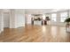 Spacious living area with hardwood floors, open floor plan, and seamless access to the kitchen at 12914 Shiraz Ln, Fishers, IN 46037