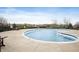 Outdoor community pool and patio area with furniture and a view of the surrounding neighborhood at 12914 Shiraz Ln, Fishers, IN 46037