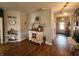 Charming hallway with hardwood floors, decorative furniture, and a welcoming ambiance at 1302 Country Creek Cir, Shelbyville, IN 46176