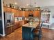 Beautiful kitchen featuring stainless steel appliances, center island, and stylish lighting at 1302 Country Creek Cir, Shelbyville, IN 46176
