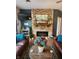 Comfortable living room featuring a stone fireplace, stylish decor, and cozy furniture at 1302 Country Creek Cir, Shelbyville, IN 46176