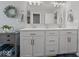 Bright bathroom with a double vanity, contemporary mirrors, and modern finishes at 1305 Bontrager Ln, Shelbyville, IN 46176