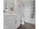 Clean bathroom with white vanity, modern fixtures, and shower with tiled surround at 1305 Bontrager Ln, Shelbyville, IN 46176
