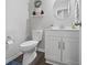 Elegant powder room with modern vanity, round mirror, and stylish fixtures at 1305 Bontrager Ln, Shelbyville, IN 46176