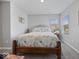 Cozy bedroom featuring a decorative bed frame, marine themed bedding, and a bright window at 1305 Bontrager Ln, Shelbyville, IN 46176