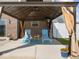 Relaxing outdoor gazebo with comfortable lounge chairs on a concrete patio at 1305 Bontrager Ln, Shelbyville, IN 46176