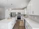 Modern kitchen with white cabinets, stainless appliances and gray subway tile backsplash at 1305 Bontrager Ln, Shelbyville, IN 46176