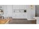 Eat-in kitchen features white cabinetry, gray backsplash, stainless appliances, and stylish countertops at 1305 Bontrager Ln, Shelbyville, IN 46176