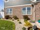 Detailed landscaping with decorative stones and thriving bushes around the home's exterior at 1305 Bontrager Ln, Shelbyville, IN 46176