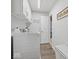 Functional laundry room with ample storage and modern washer, dryer and a folding table at 1305 Bontrager Ln, Shelbyville, IN 46176
