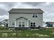 A spacious backyard featuring well-maintained vinyl siding and a cozy patio area at 1573 Vera Blvd, Danville, IN 46122