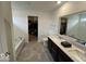 Bright bathroom features double sinks, tub, and walk-in closet at 1573 Vera Blvd, Danville, IN 46122