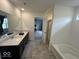 Bright bathroom features double sinks, tub, and glass shower at 1573 Vera Blvd, Danville, IN 46122
